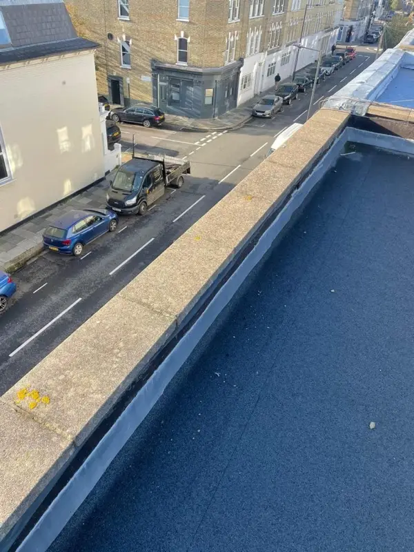Felt flat roof with lead-covered parapet wall completed on a Guildford terrace